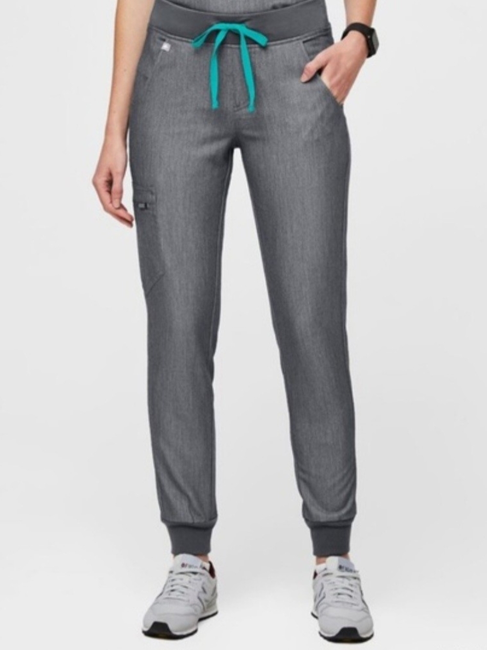 FIGS Zamora high-waisted jogger scrub pants with teal drawstring.